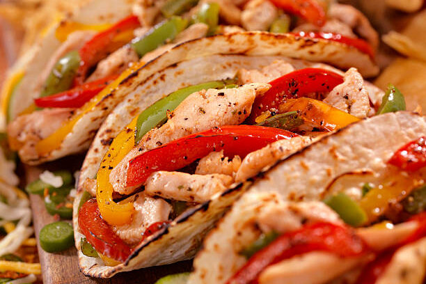 Tacolab LA chicken fajita tacos with grilled peppers and onions for premium catering in Los Angeles. Fresh and flavorful option.