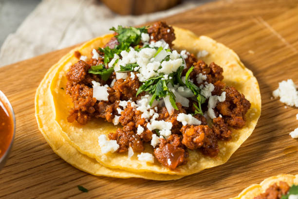 Tacolab LA authentic chorizo tacos for catering in Los Angeles. Spicy Mexican sausage tacos with chopped onion, fresh cilantro, and crumbled cheese on corn tortillas.