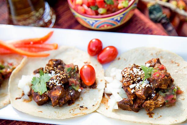 Tacolab LA mole tacos with tender chicken in rich mole sauce for premium catering in Los Angeles. Traditional Mexican flavor.
